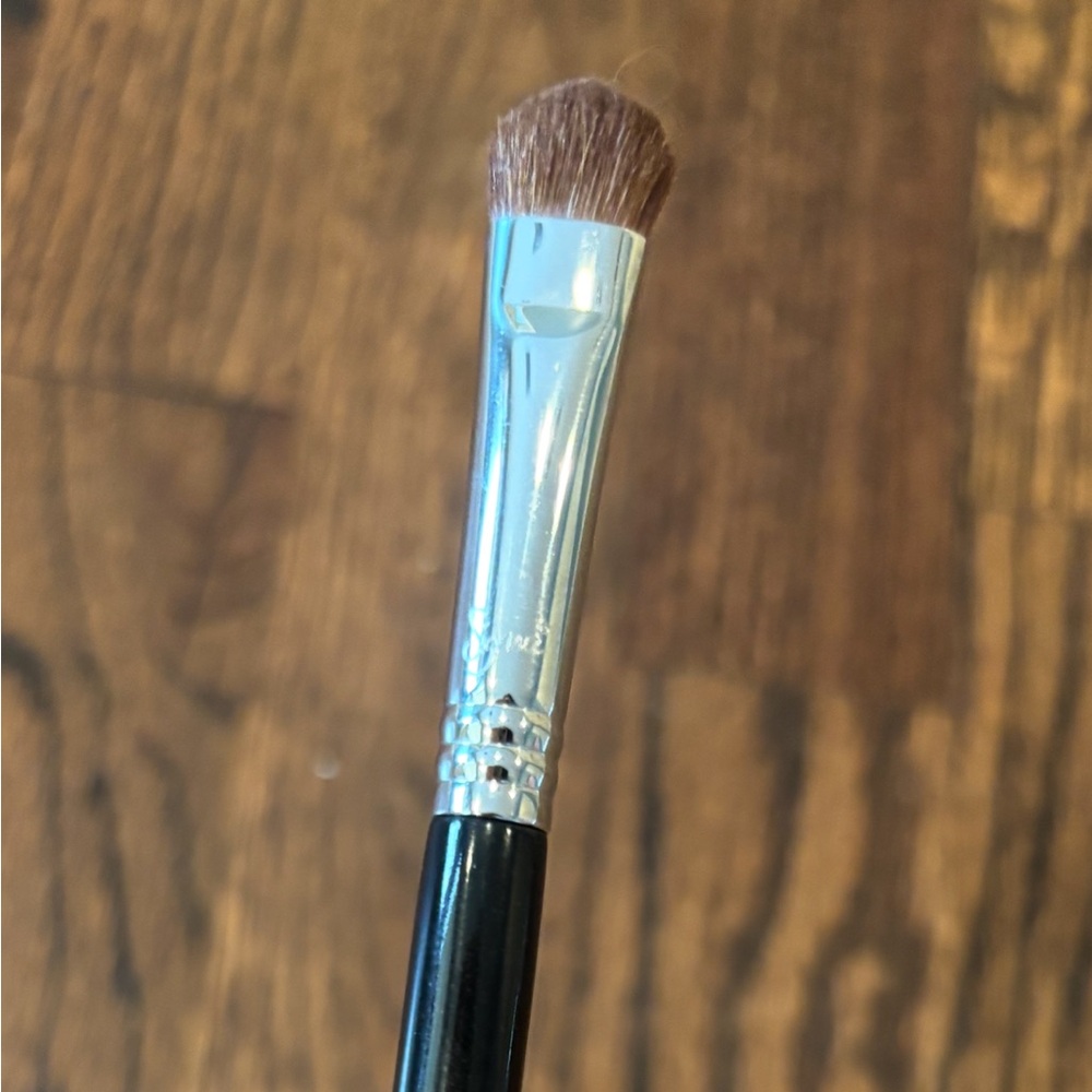 Sigma Beauty E55 Eye Shading Brush - Sleek Black with silver ferrule.